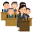 女性の議員が発言しているイラストです。